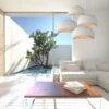 Suspension Design Wabi Sabi Sofia blanc dans salon donnant sur piscine