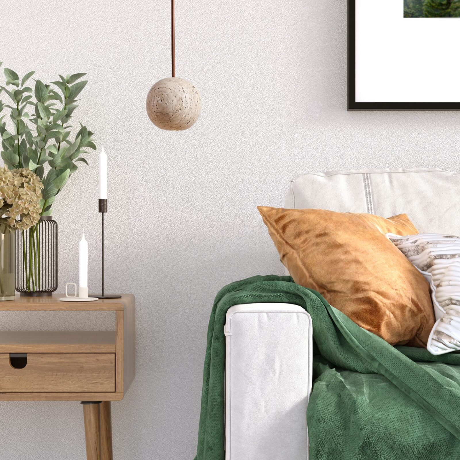 Suspension design boule sur canapé blanc et vert