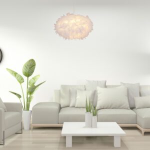 Suspension luminaire plume dans salon avec canapé clair
